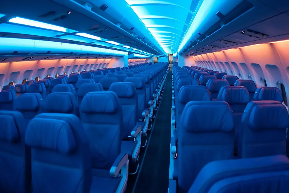 Empty airplane cabin with lights dimmed